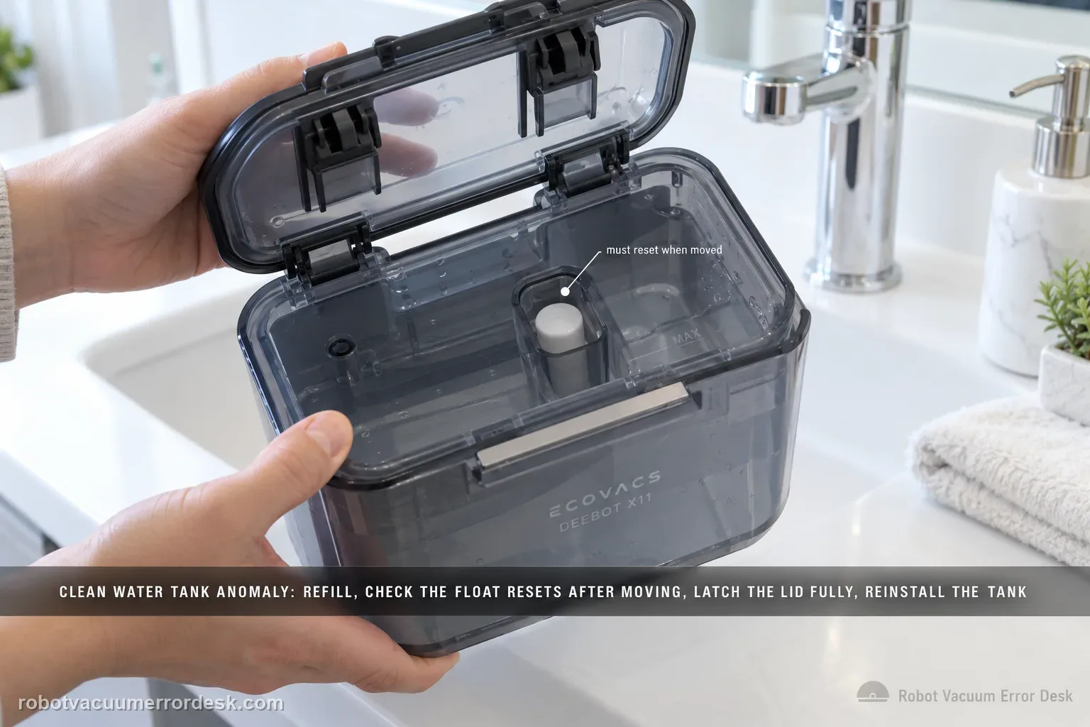 Hands holding an ECOVACS DEEBOT X11 clean-water tank tilted open on a bright bathroom counter to show the float inside and the lid latch.
