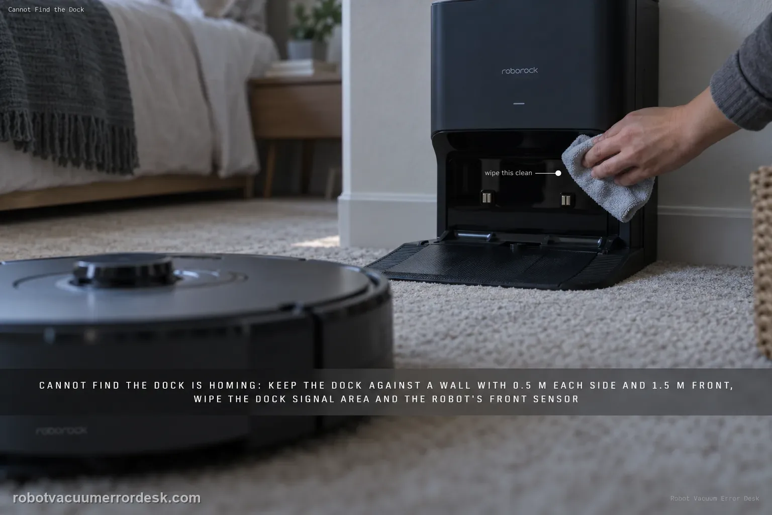 A hand wiping the signal-transmission strip on the front of a Roborock S8 dock set against a bedroom wall, the robot approaching on low-pile carpet.